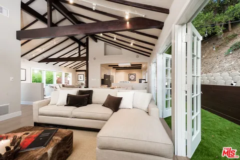 a living room with furniture and a outdoor space