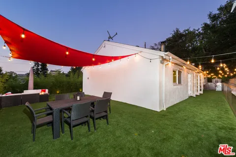 a patio with table and chairs