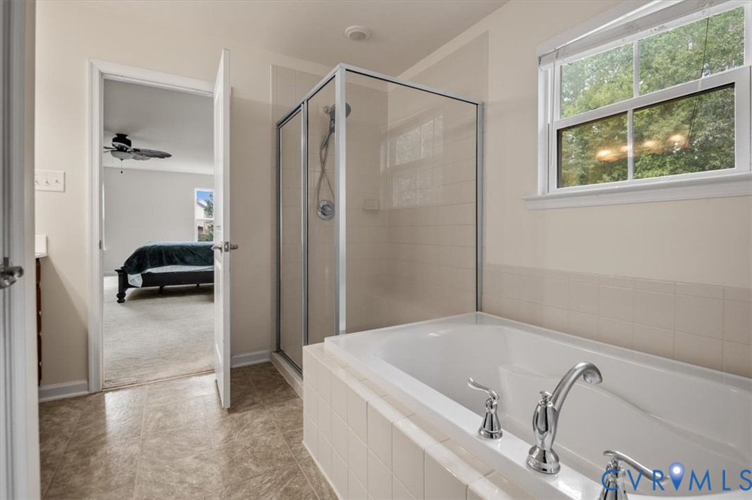 9013 Bailey Hill Road Midlothian, VA 23112 - Photo 37 of 56 Bathroom featuring a built-in soaking tub with chr
