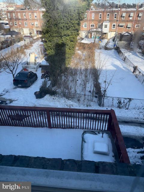 337 Copley Road Upper Darby, PA 19082 - Photo 13 of 13 Snowy backyard view with cozy charm.