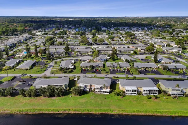 an aerial view of a house with a big yard