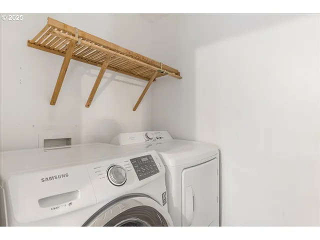 a view of a house with a door and wooden floor