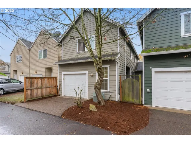 a front view of a house with a garage