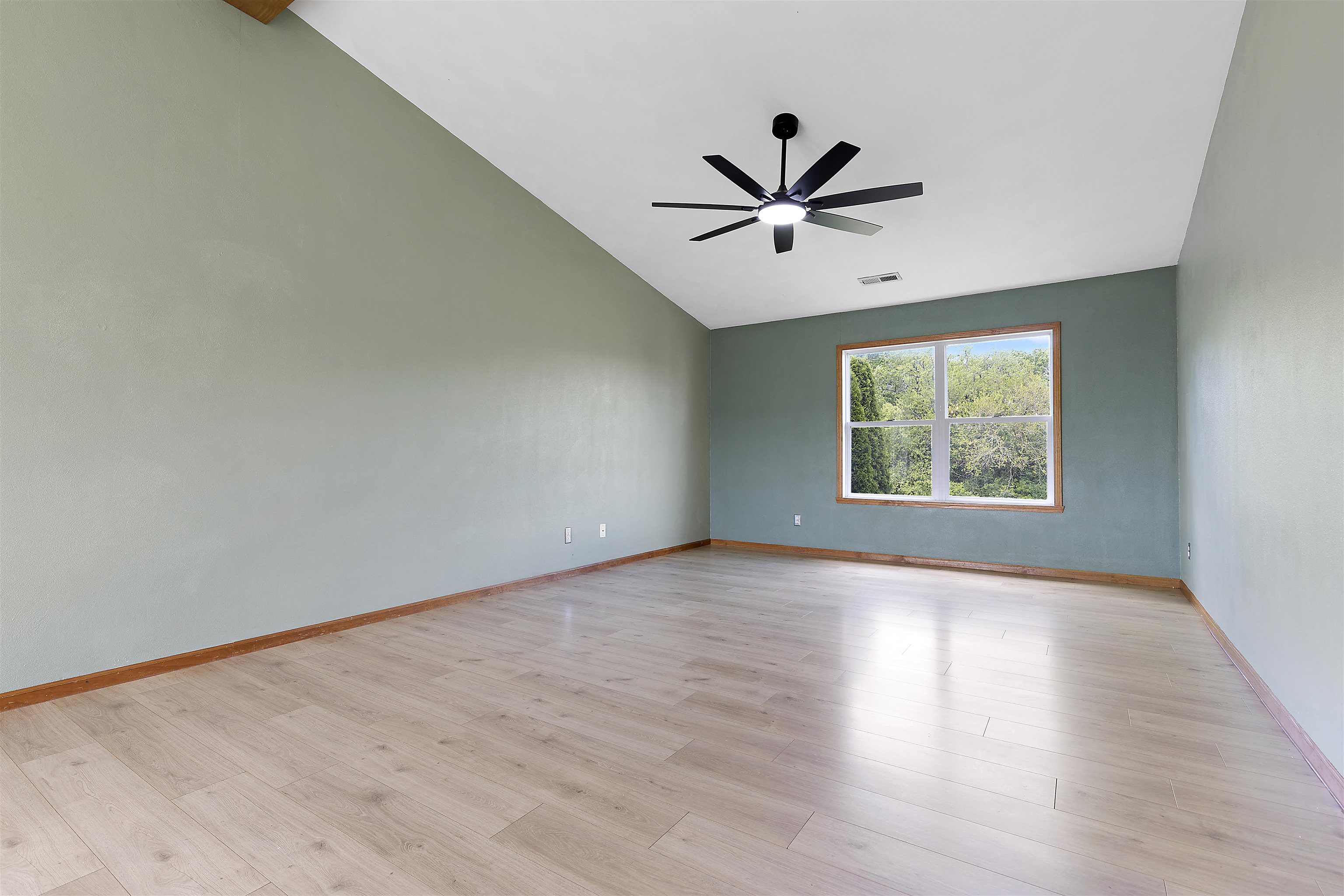 10050 Skipperling Road Roscoe, IL 61073 - Photo 4 of 15 wooden floor in an empty room with a window