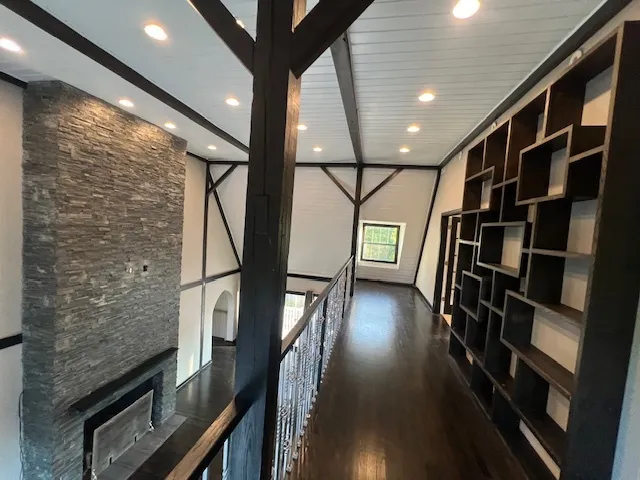 a view of a house with wooden deck