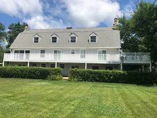 a kitchen with stainless steel appliances a refrigerator and a stove top oven
