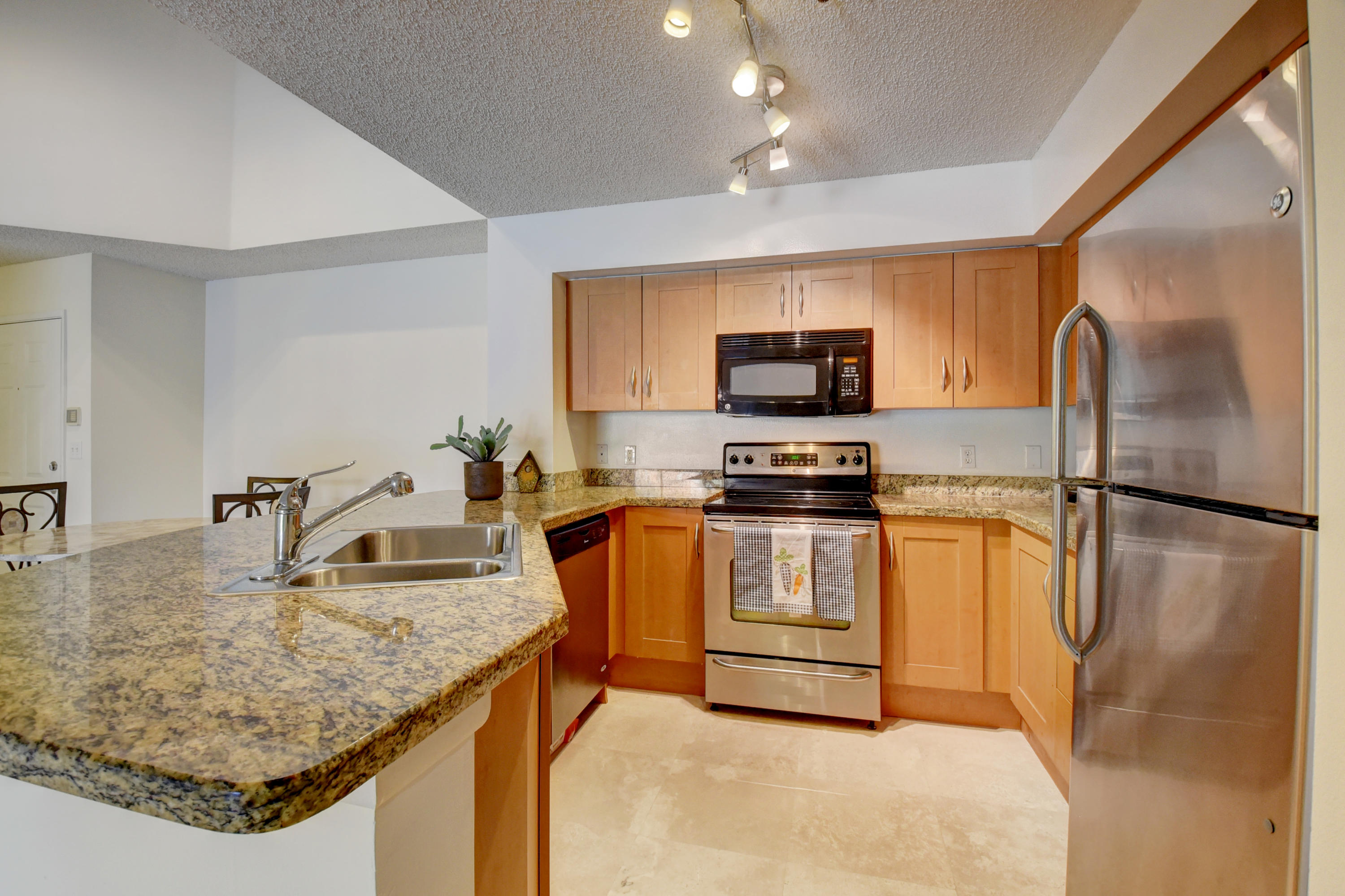 3133 Clint Moore Road, Unit 205 Boca Raton, FL 33496 - Photo 1 of 28 REMODELED KITCHEN