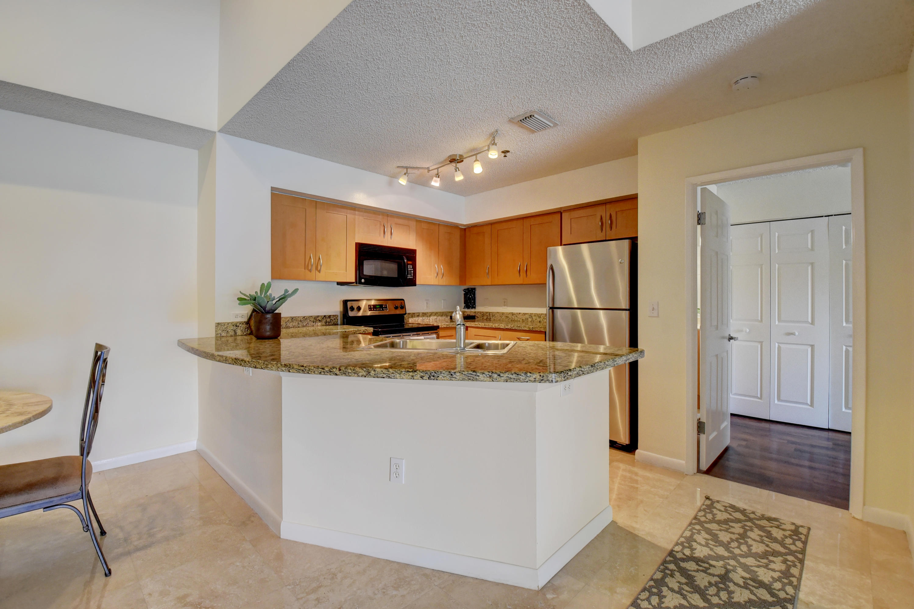 3133 Clint Moore Road, Unit 205 Boca Raton, FL 33496 - Photo 4 of 28 GRANITE SNACK BAR