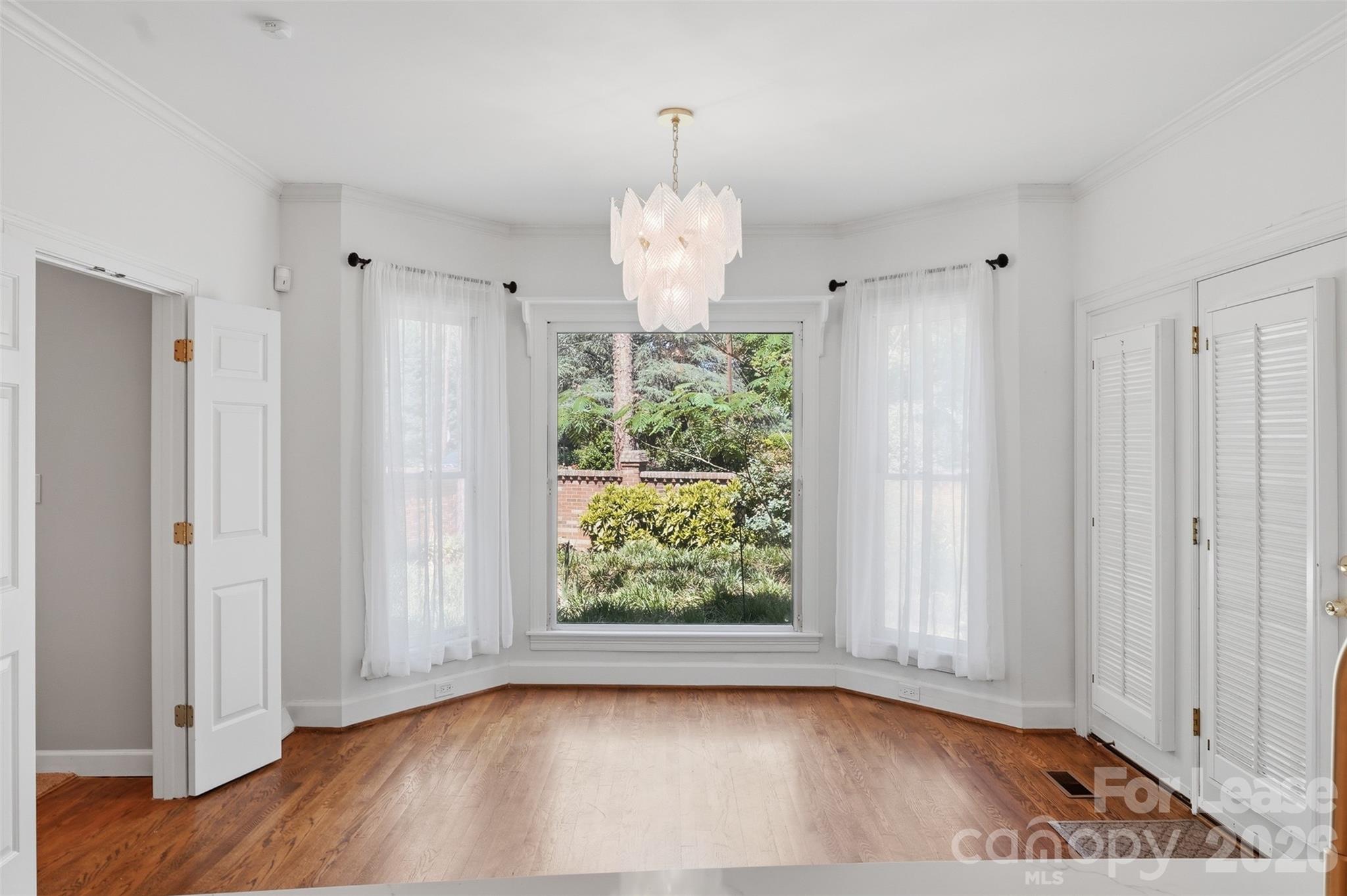 5906 Sharon Hills Road Charlotte, NC 28210 - Photo 17 of 30 a view of an empty room with a window