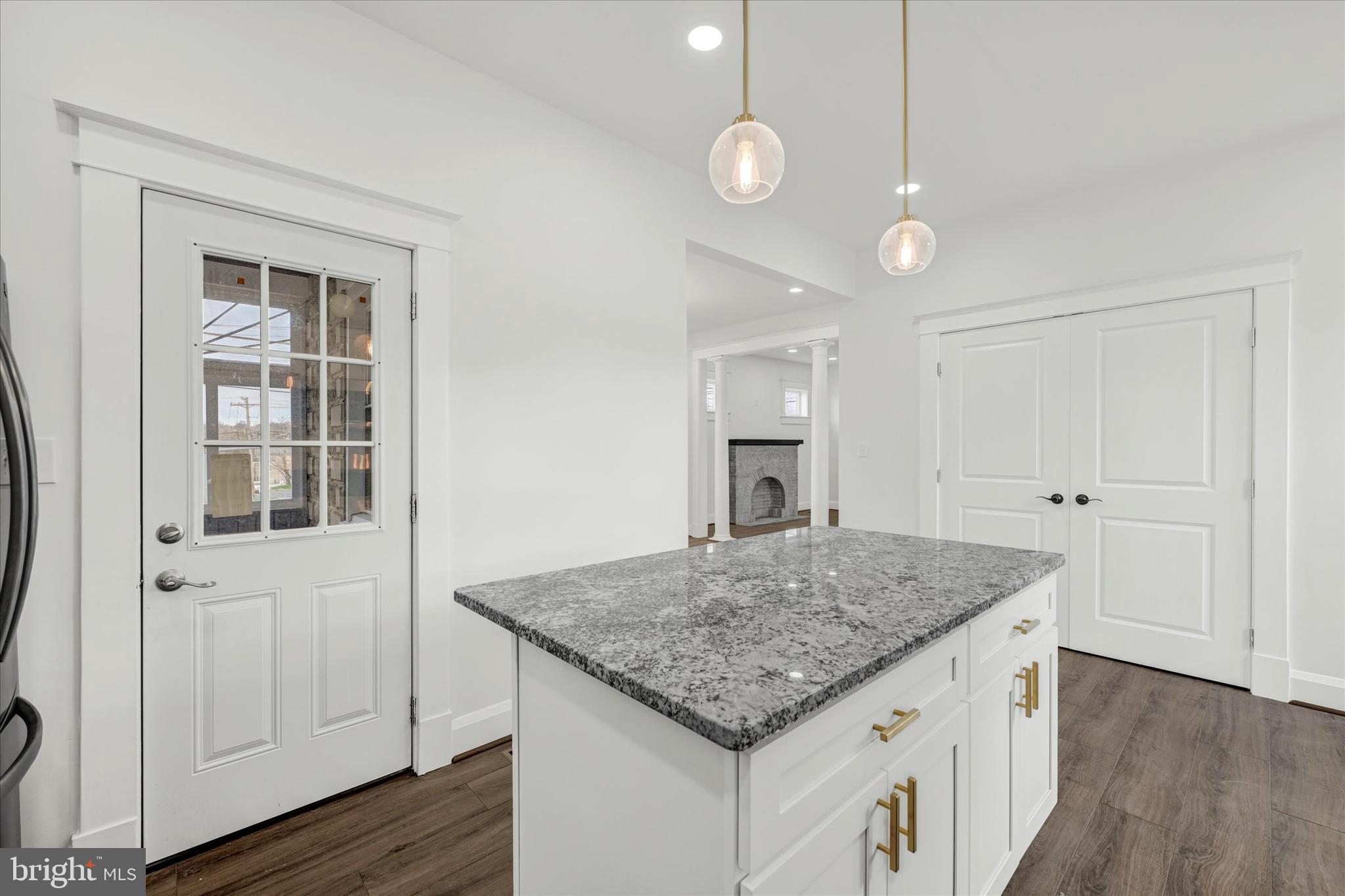 1127 Chesaco Avenue Rosedale, MD 21237 - Photo 15 of 38 a view of kitchen island of wooden floor and window