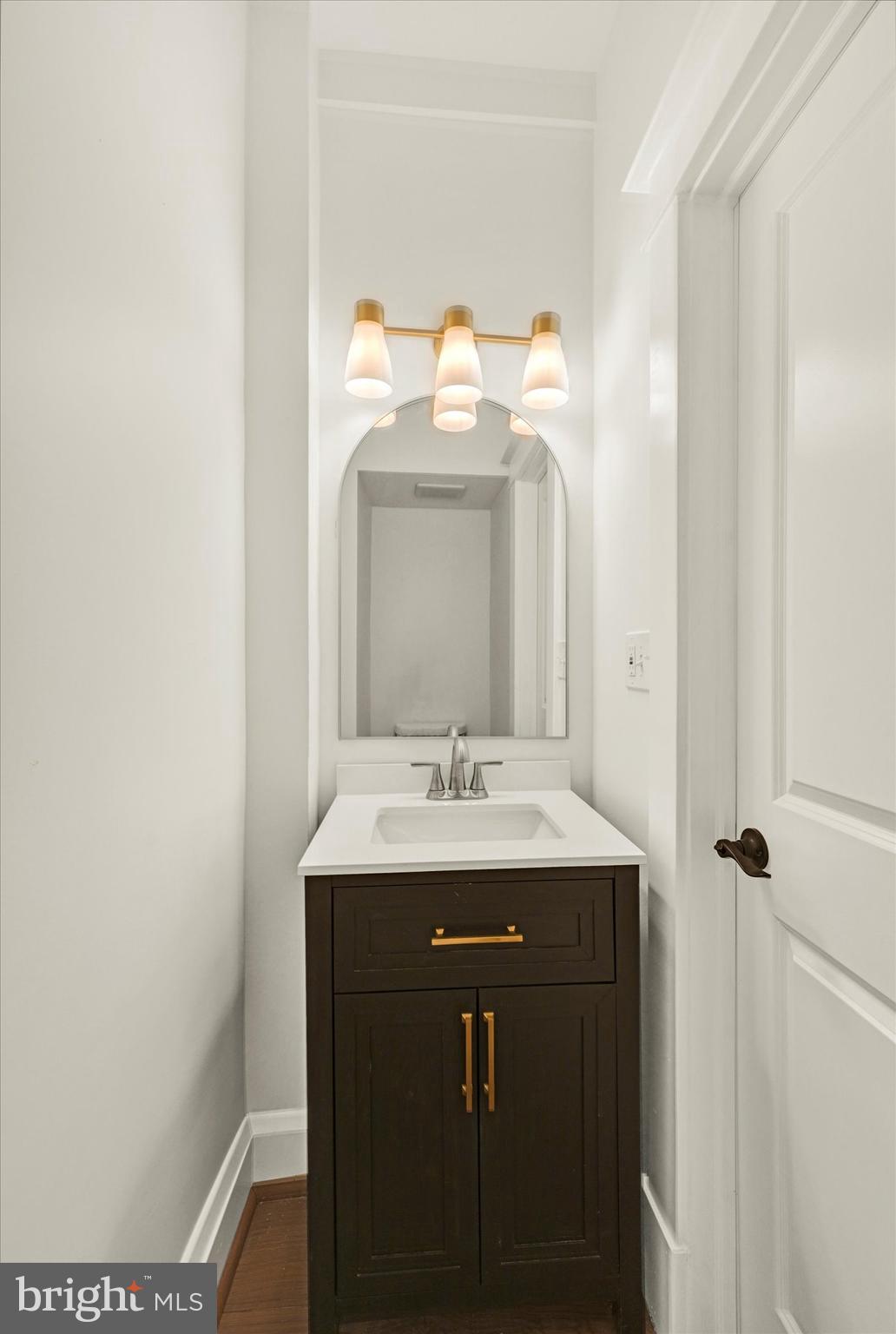 1127 Chesaco Avenue Rosedale, MD 21237 - Photo 17 of 38 a bathroom with a sink and a mirror