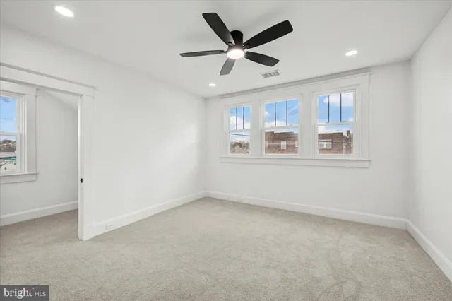 a view of an empty room with a window