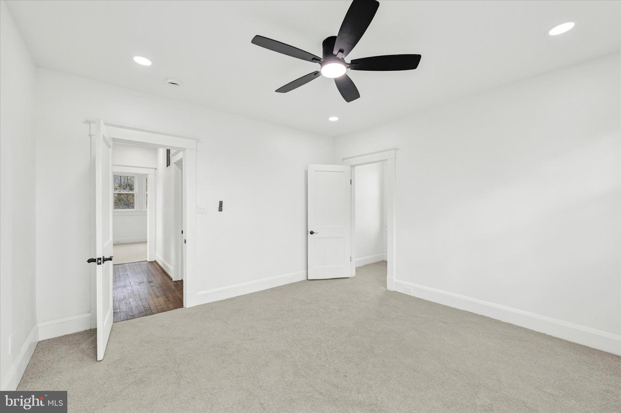 1127 Chesaco Avenue Rosedale, MD 21237 - Photo 20 of 38 an empty room with ceiling fan and window
