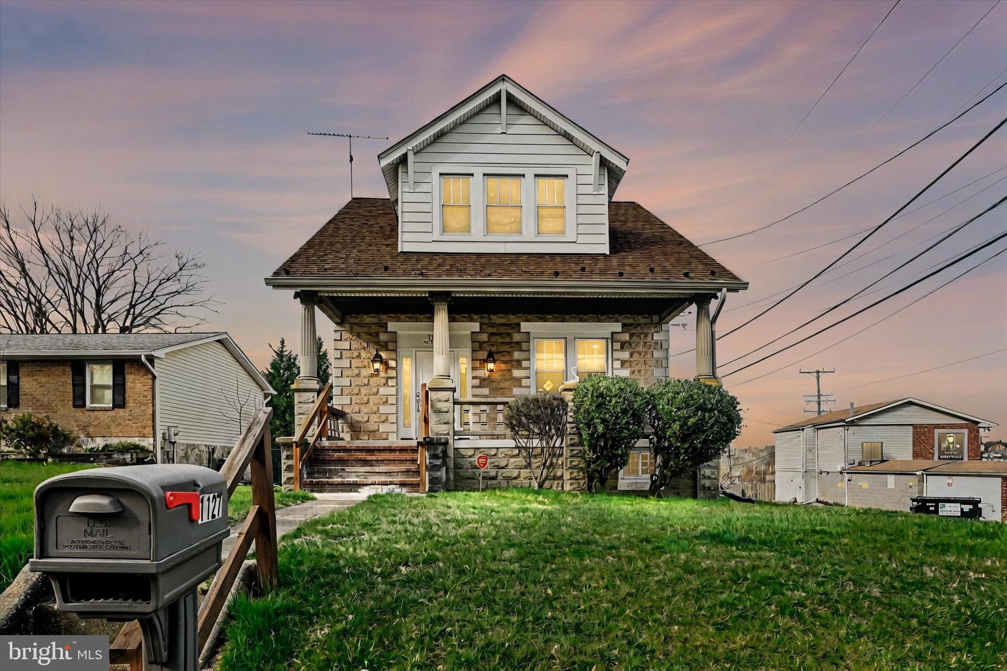 1127 Chesaco Avenue Rosedale, MD 21237 - Photo 2 of 38 a front view of a house with garden