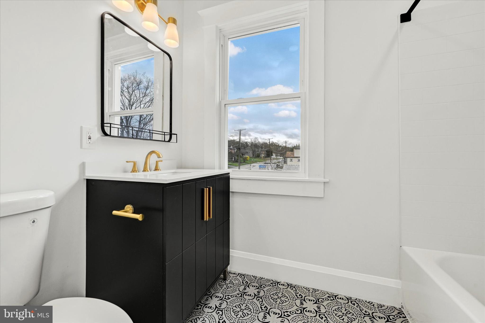 1127 Chesaco Avenue Rosedale, MD 21237 - Photo 26 of 38 a bathroom with a sink and a toilet