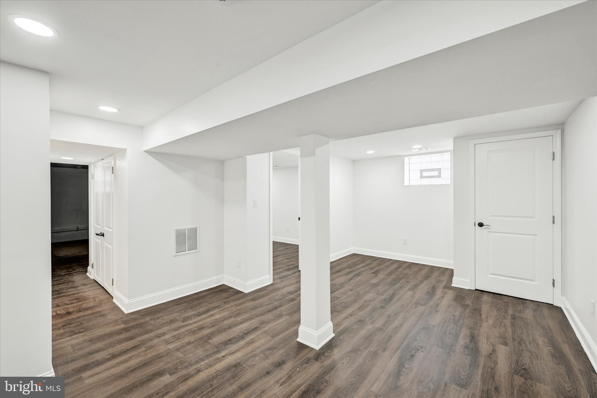 1127 Chesaco Avenue Rosedale, MD 21237 - Photo 28 of 38 a view of an empty room with wooden floor