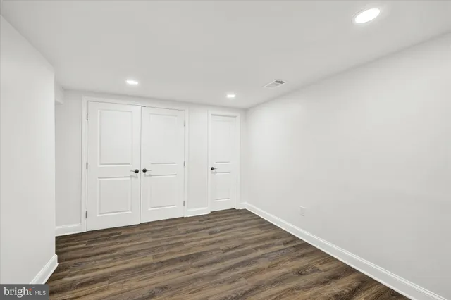 a view of room with wooden floor