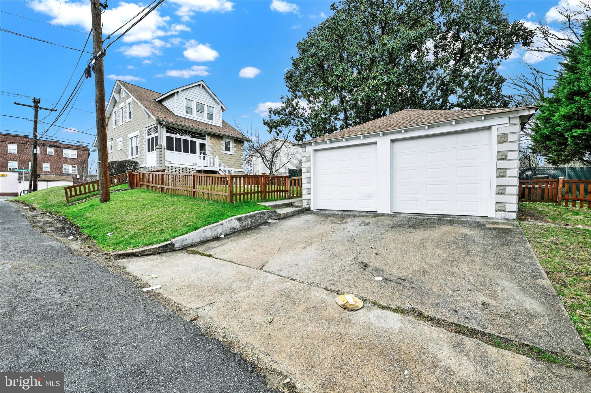 1127 Chesaco Avenue Rosedale, MD 21237 - Photo 36 of 38 a view of a house with a yard and garage