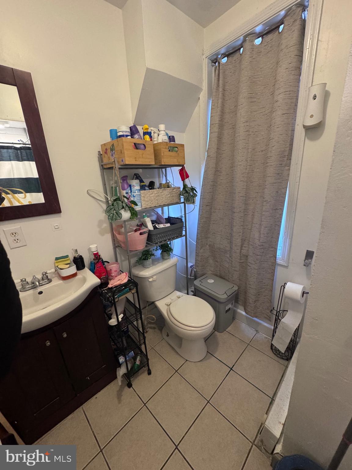213 Juniata Street Lancaster, PA 17602 - Photo 5 of 16 a bathroom with a sink toilet and shower