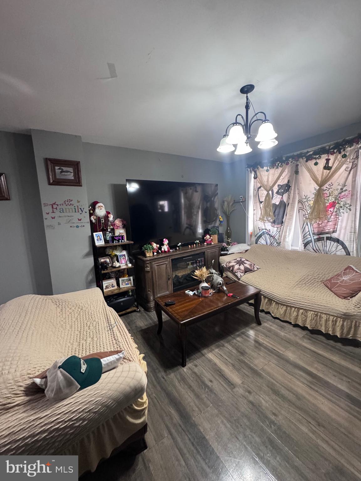 213 Juniata Street Lancaster, PA 17602 - Photo 6 of 16 a living room with furniture and wooden floor