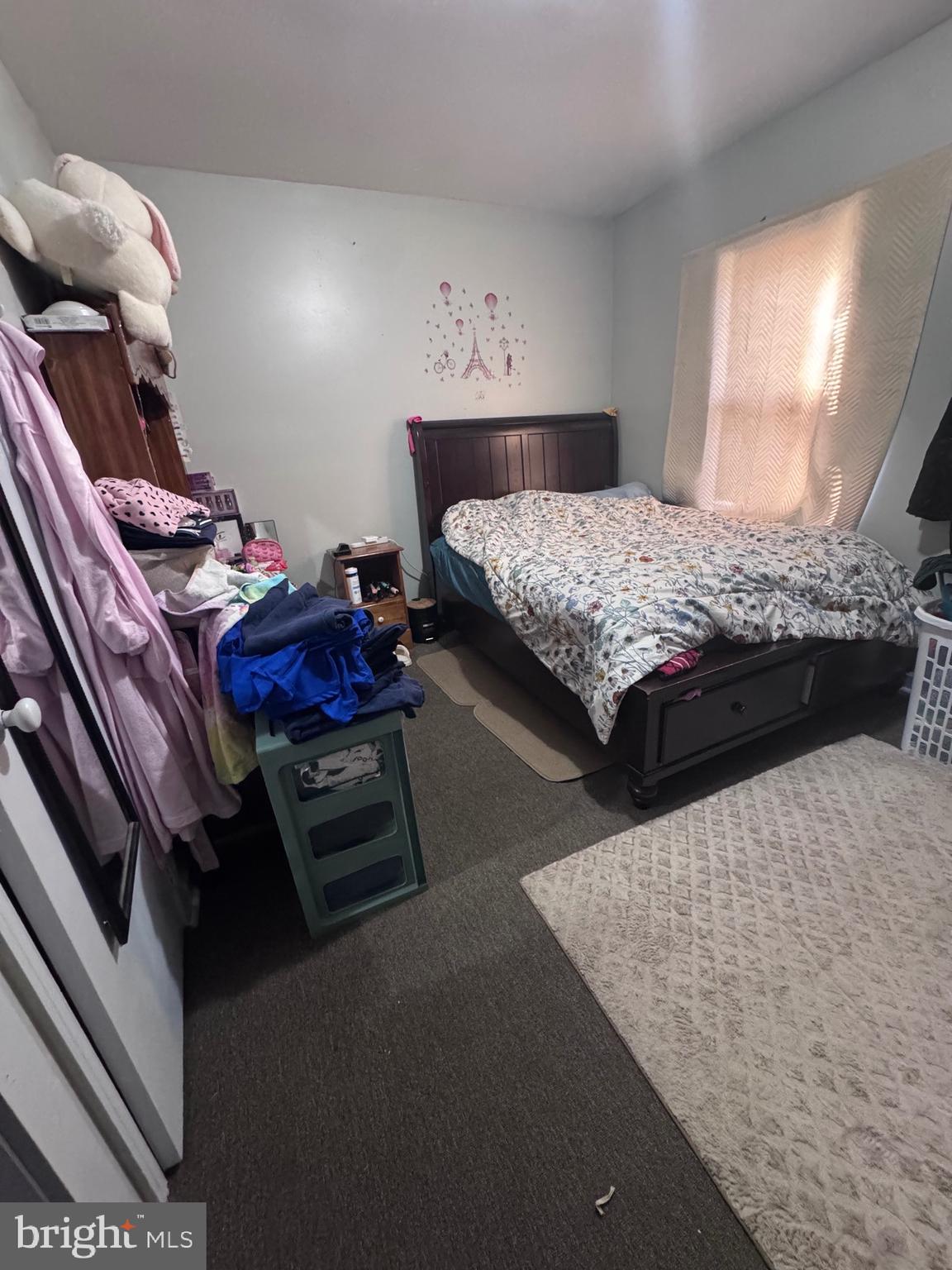 213 Juniata Street Lancaster, PA 17602 - Photo 7 of 16 a bedroom with a bed and window