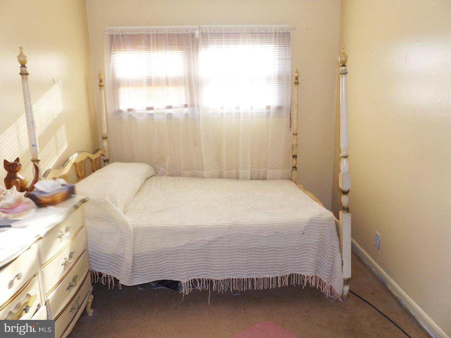 971 Victoria Road Warminster, PA 18974 - Photo 12 of 15 a large bed sitting in a bedroom next to a window