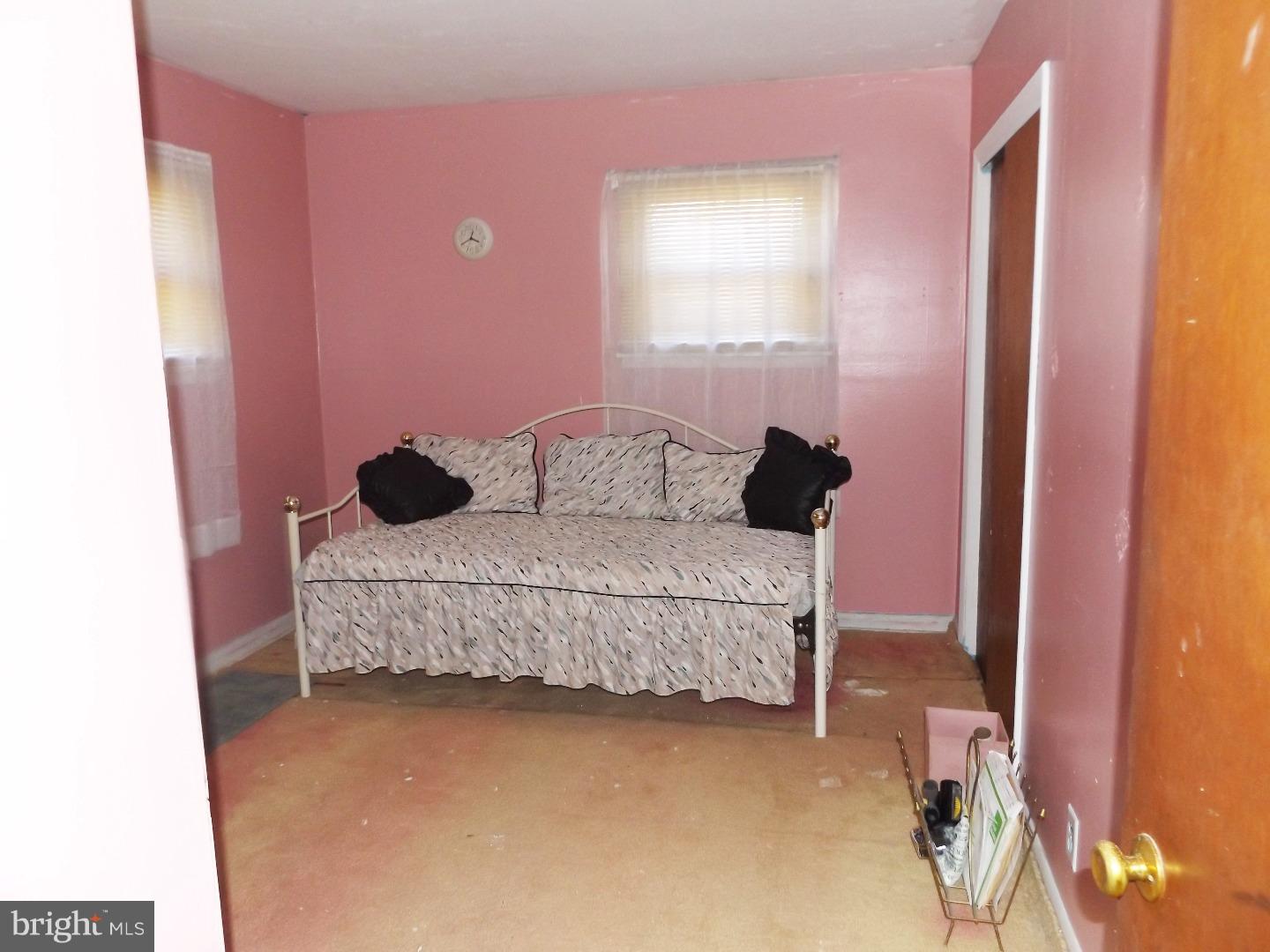 971 Victoria Road Warminster, PA 18974 - Photo 13 of 15 a bedroom with a bed and a mirror