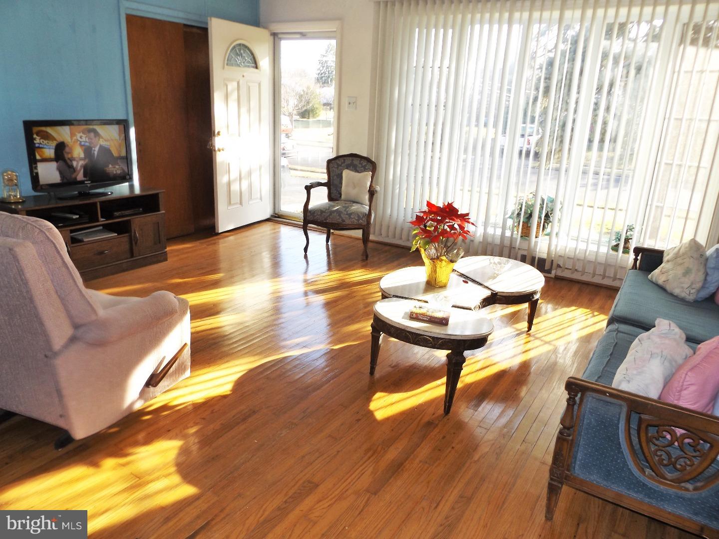 971 Victoria Road Warminster, PA 18974 - Photo 3 of 15 a living room with furniture a window and a flat screen tv