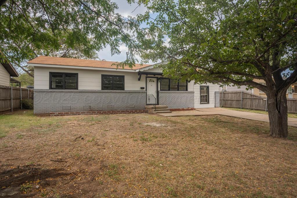 5122 Crockett Street Amarillo, TX 79110 - Photo 2 of 17 a house with trees in front of it