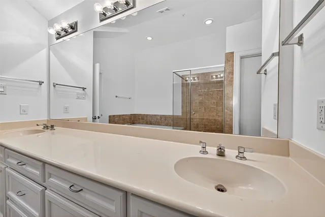 a bathroom with a bathtub and shower