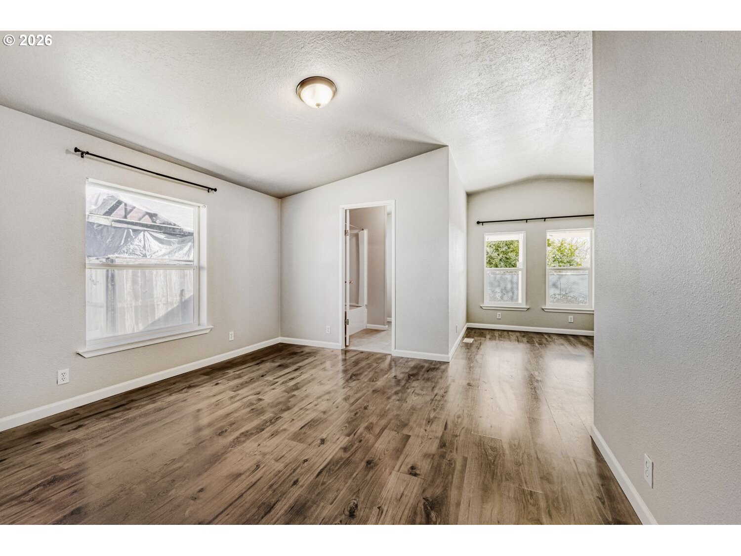 2431 North Fremont Street Cornelius, OR 97113 - Photo 18 of 29 a view of an empty room with wooden floor and a window
