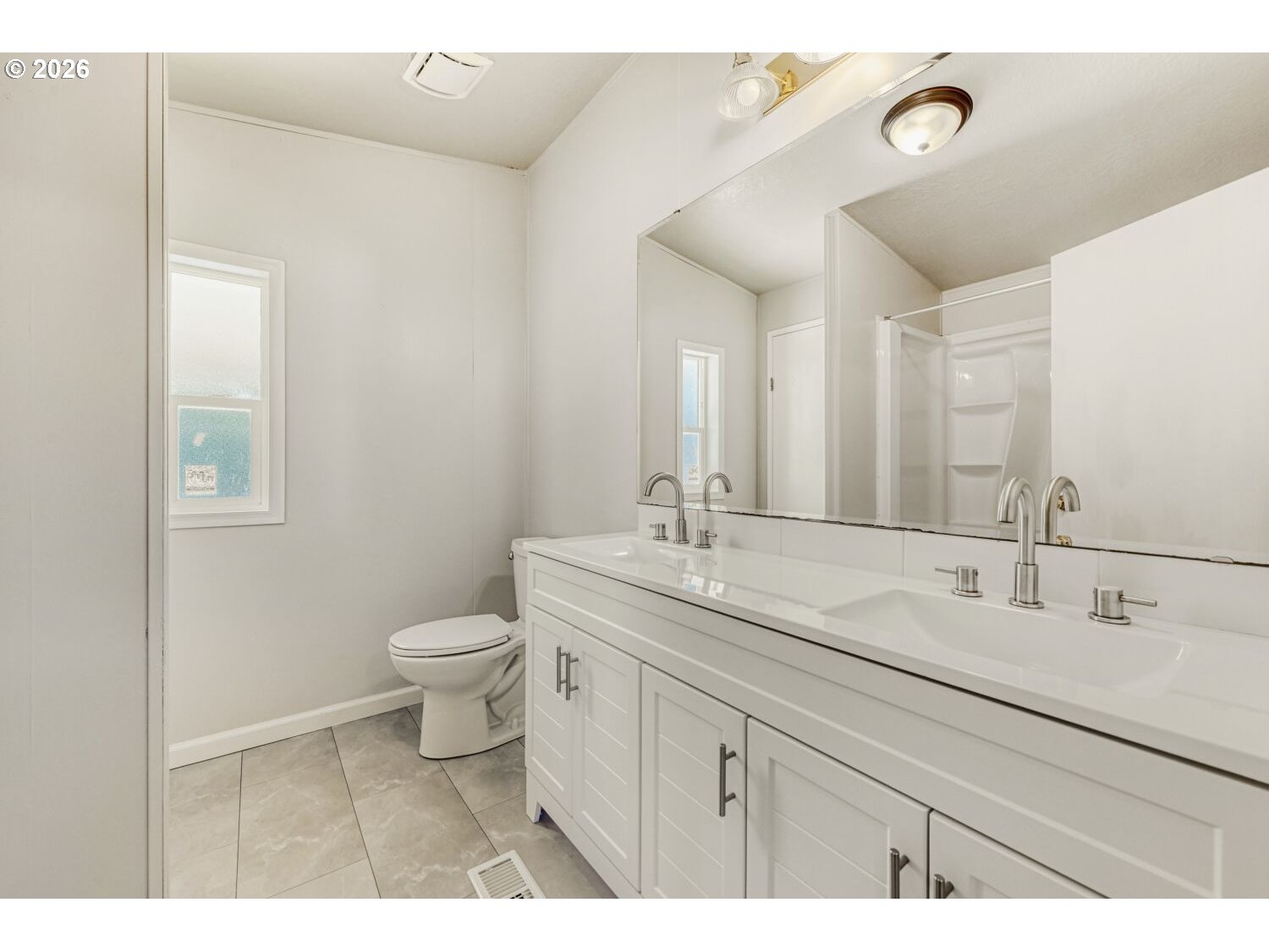 2431 North Fremont Street Cornelius, OR 97113 - Photo 19 of 29 a bathroom with a toilet a sink a mirror and vanity