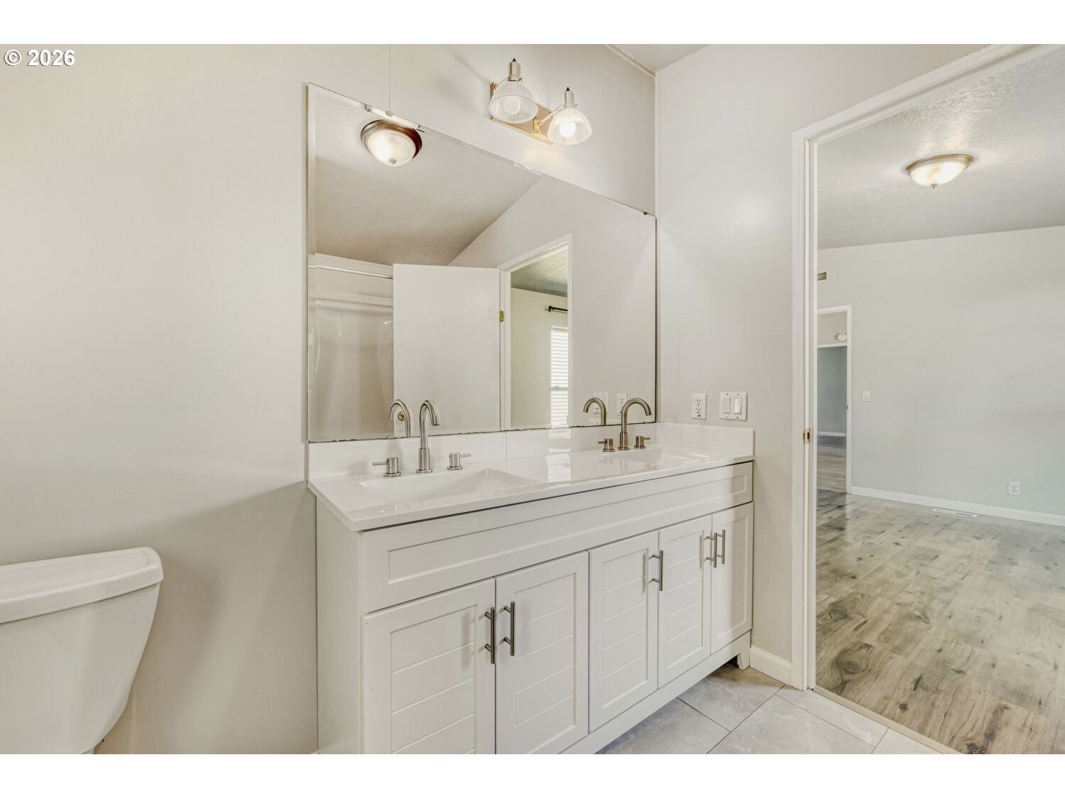 2431 North Fremont Street Cornelius, OR 97113 - Photo 20 of 29 a bathroom with a sink a toilet and a mirror