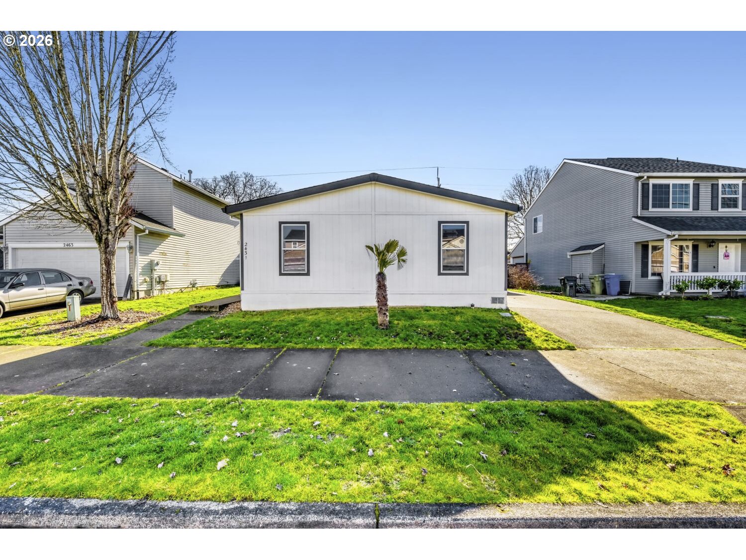 2431 North Fremont Street Cornelius, OR 97113 - Photo 4 of 29 a front view of a house with a yard and garage
