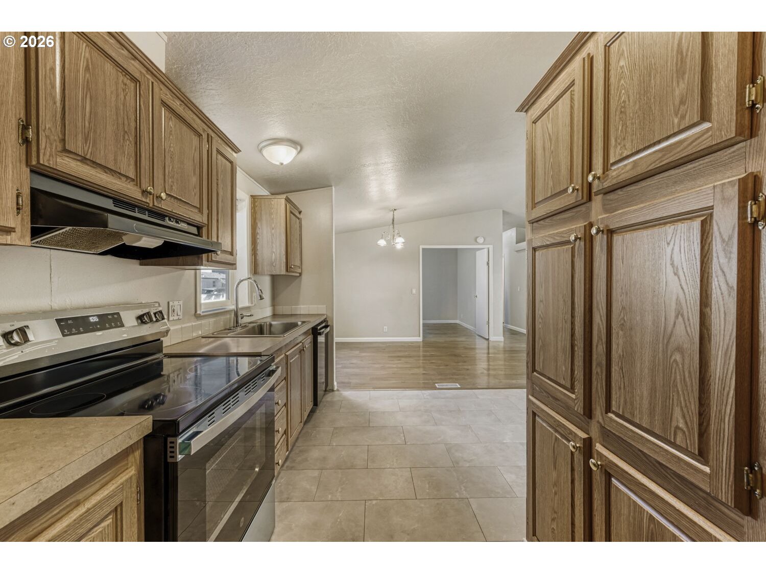 2431 North Fremont Street Cornelius, OR 97113 - Photo 5 of 29 a kitchen with stainless steel appliances granite countertop a refrigerator a stove and a sink