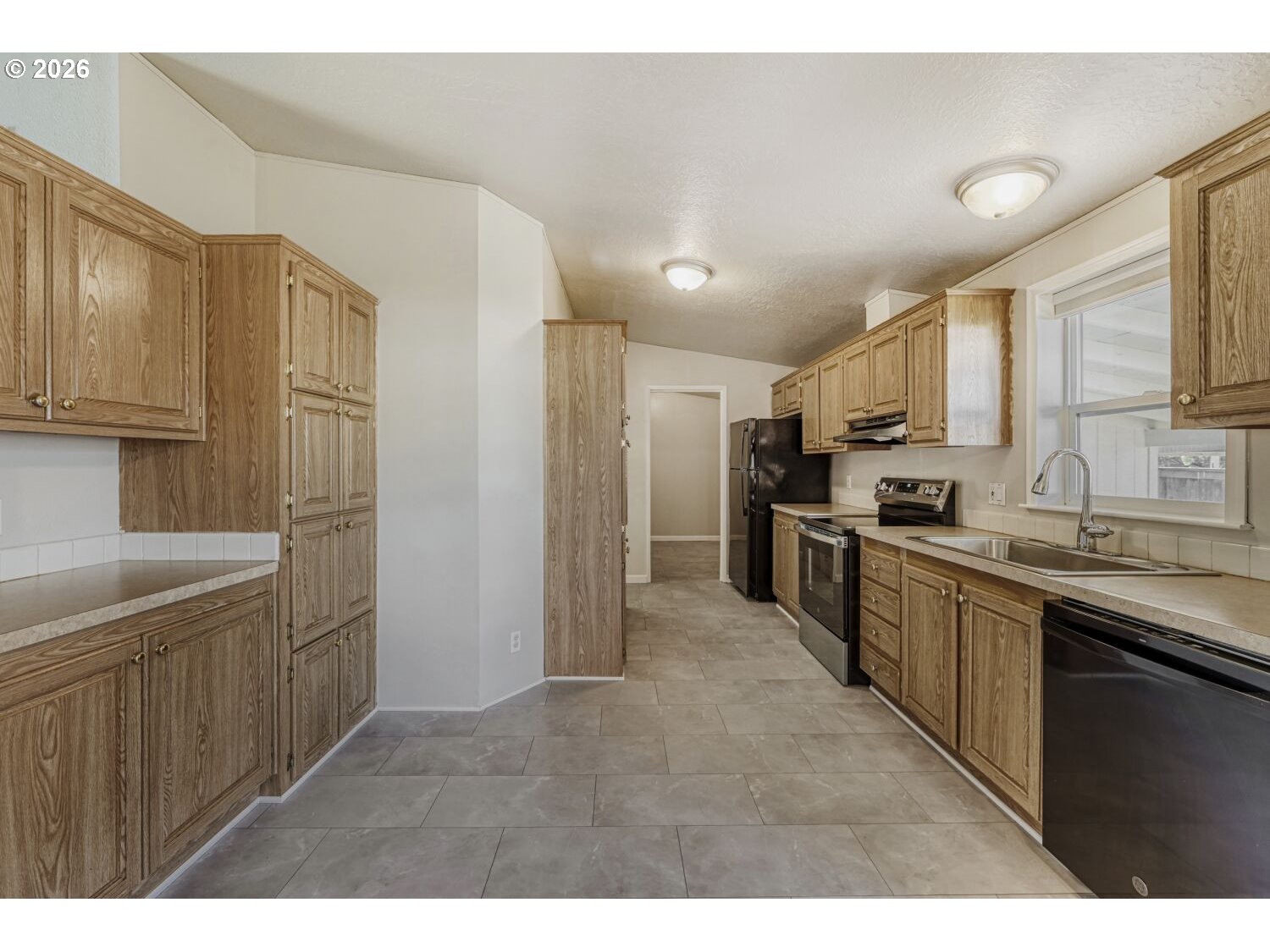 2431 North Fremont Street Cornelius, OR 97113 - Photo 7 of 29 a kitchen with stainless steel appliances granite countertop a refrigerator and a sink