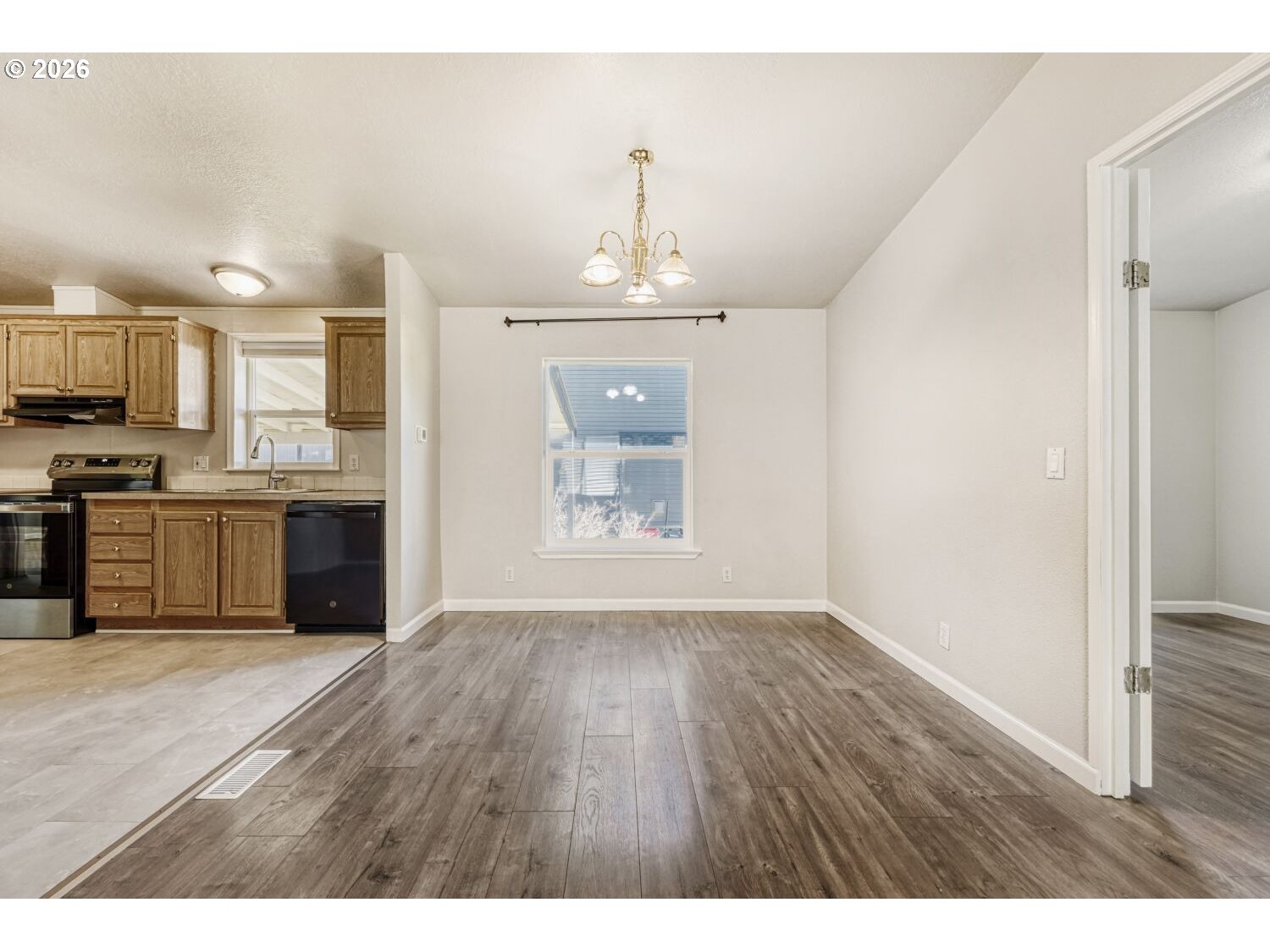 2431 North Fremont Street Cornelius, OR 97113 - Photo 8 of 29 a view of a kitchen with a sink cabinets and wooden floor