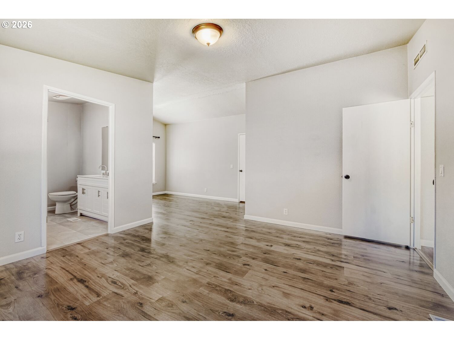 2431 North Fremont Street Cornelius, OR 97113 - Photo 10 of 29 a view of an empty room and wooden floor