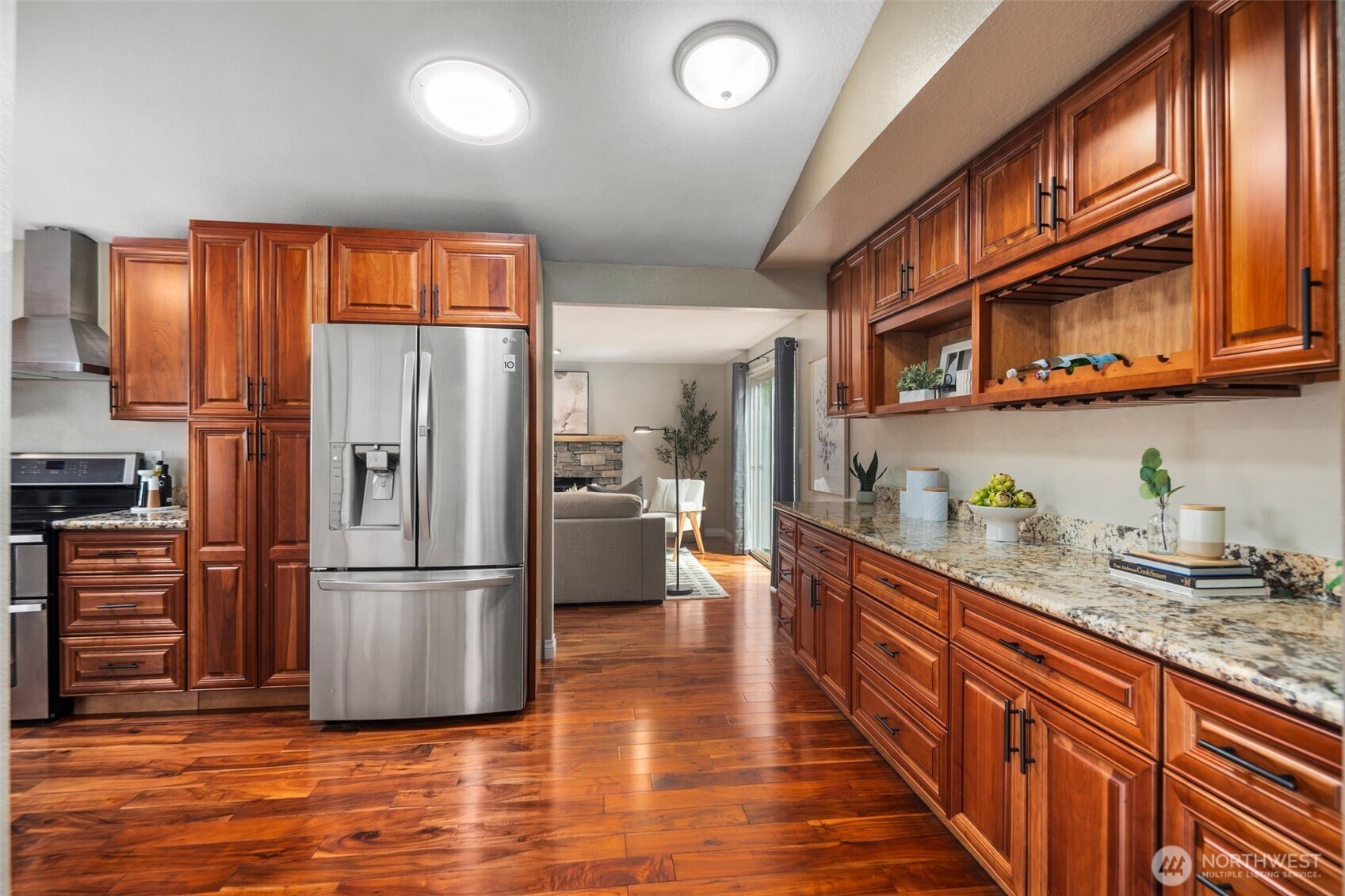 22707 14th Place West Bothell, WA 98021 - Photo 11 of 39 a kitchen with stainless steel appliances granite countertop a refrigerator a stove and a sink with cabinets
