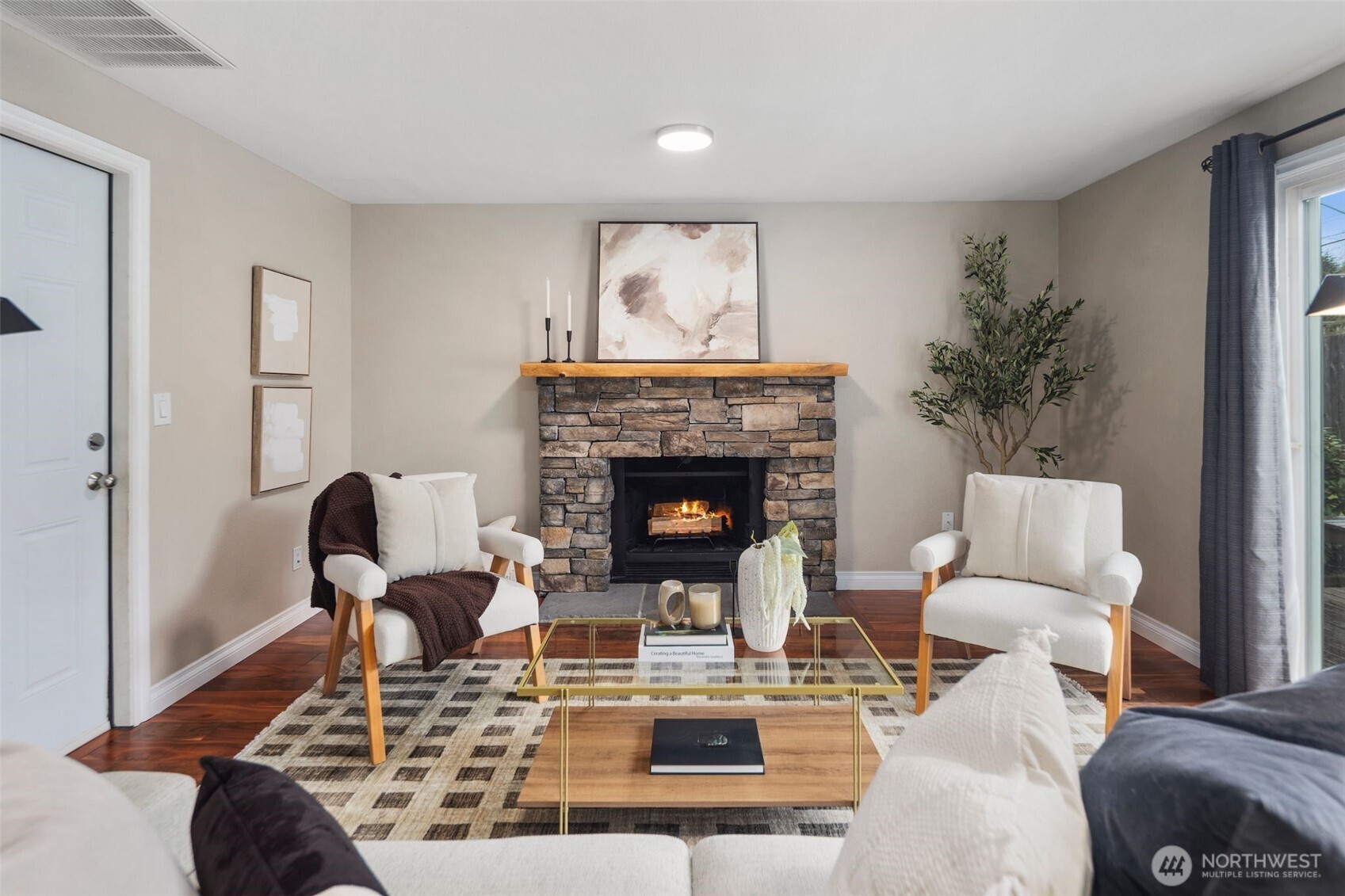 22707 14th Place West Bothell, WA 98021 - Photo 17 of 39 a living room with furniture a fireplace and a potted plant