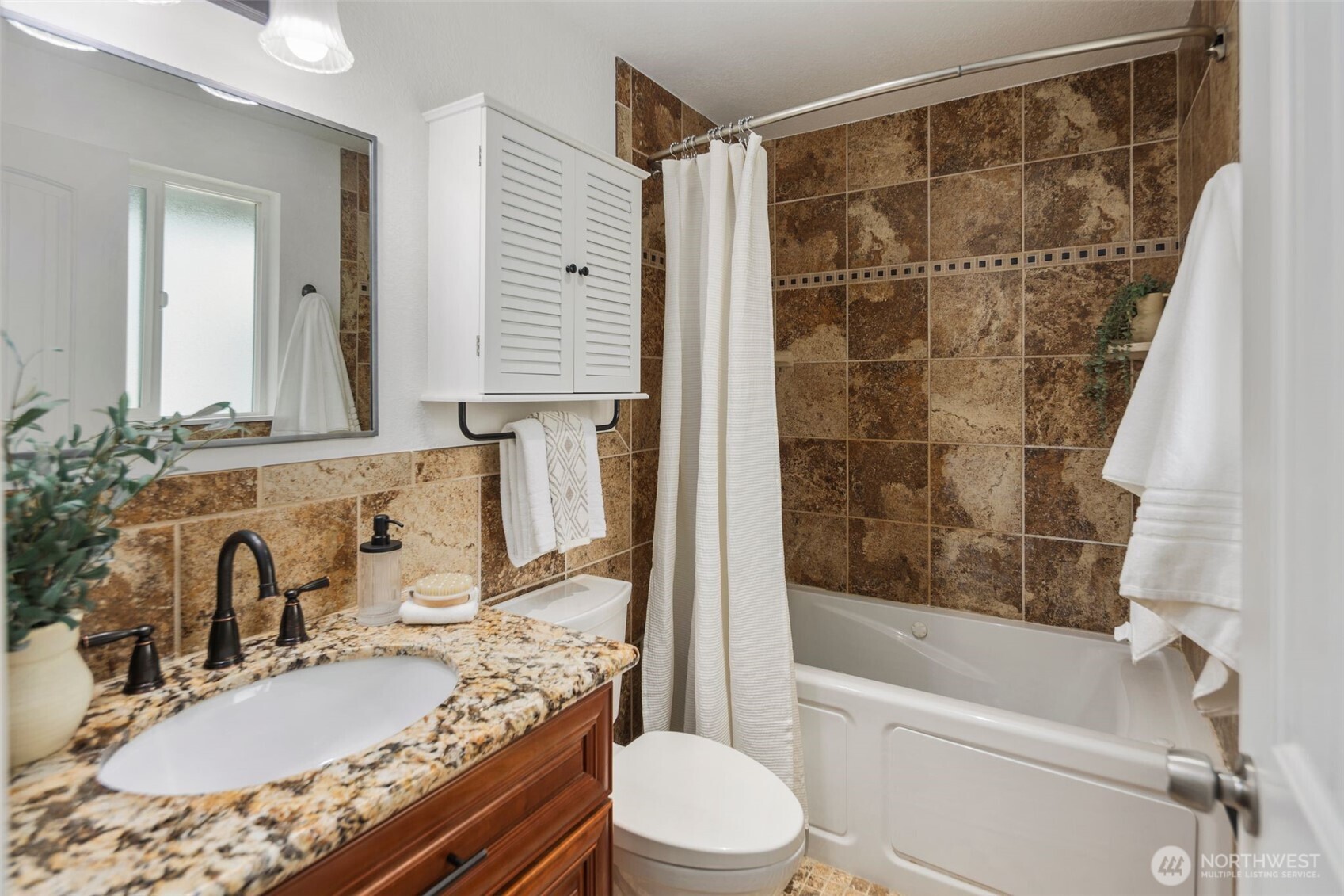 22707 14th Place West Bothell, WA 98021 - Photo 25 of 39 a bathroom with a granite countertop sink toilet and shower