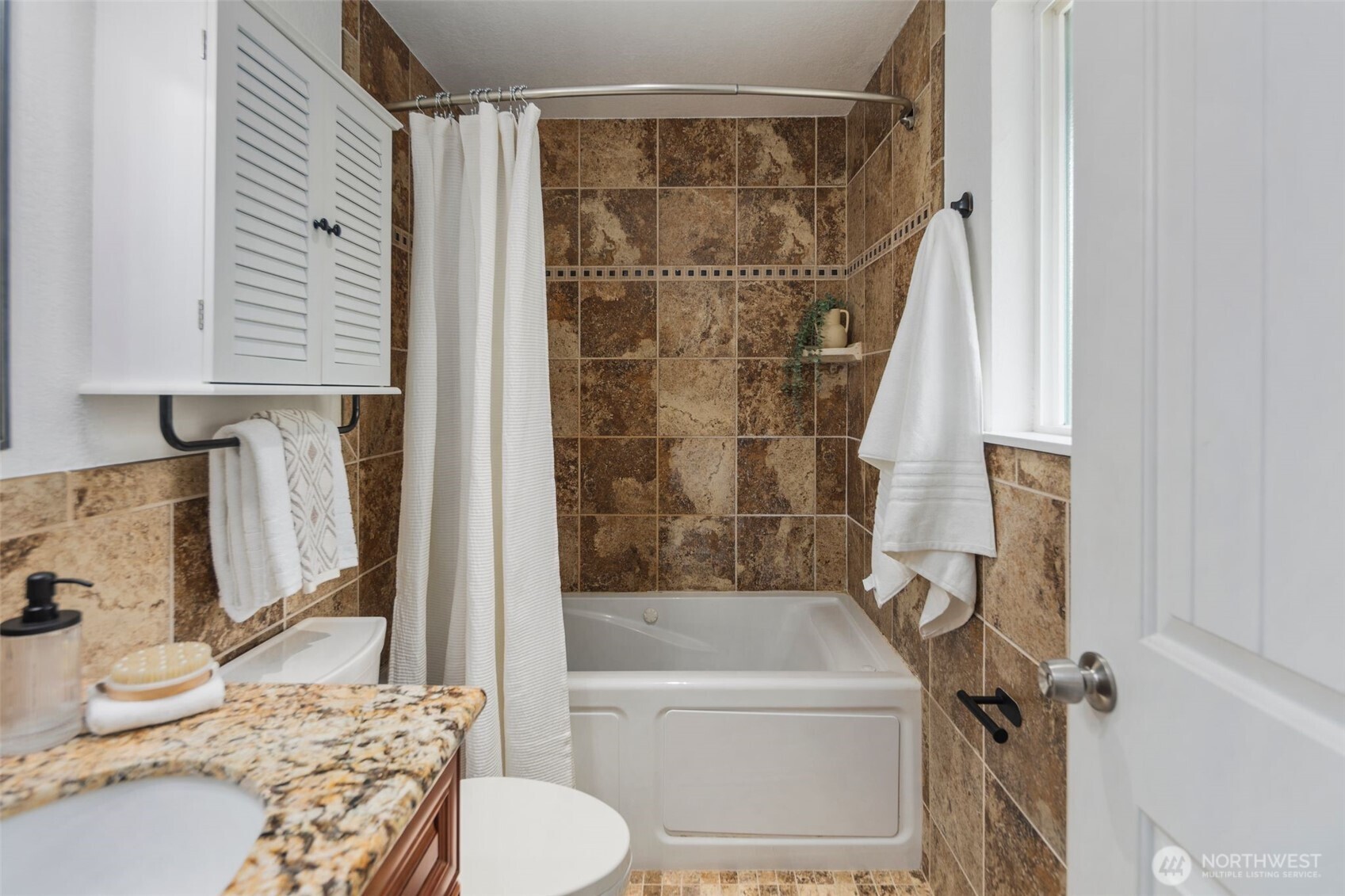 22707 14th Place West Bothell, WA 98021 - Photo 26 of 39 a bathroom with a granite countertop bathtub shower sink vanity and toilet