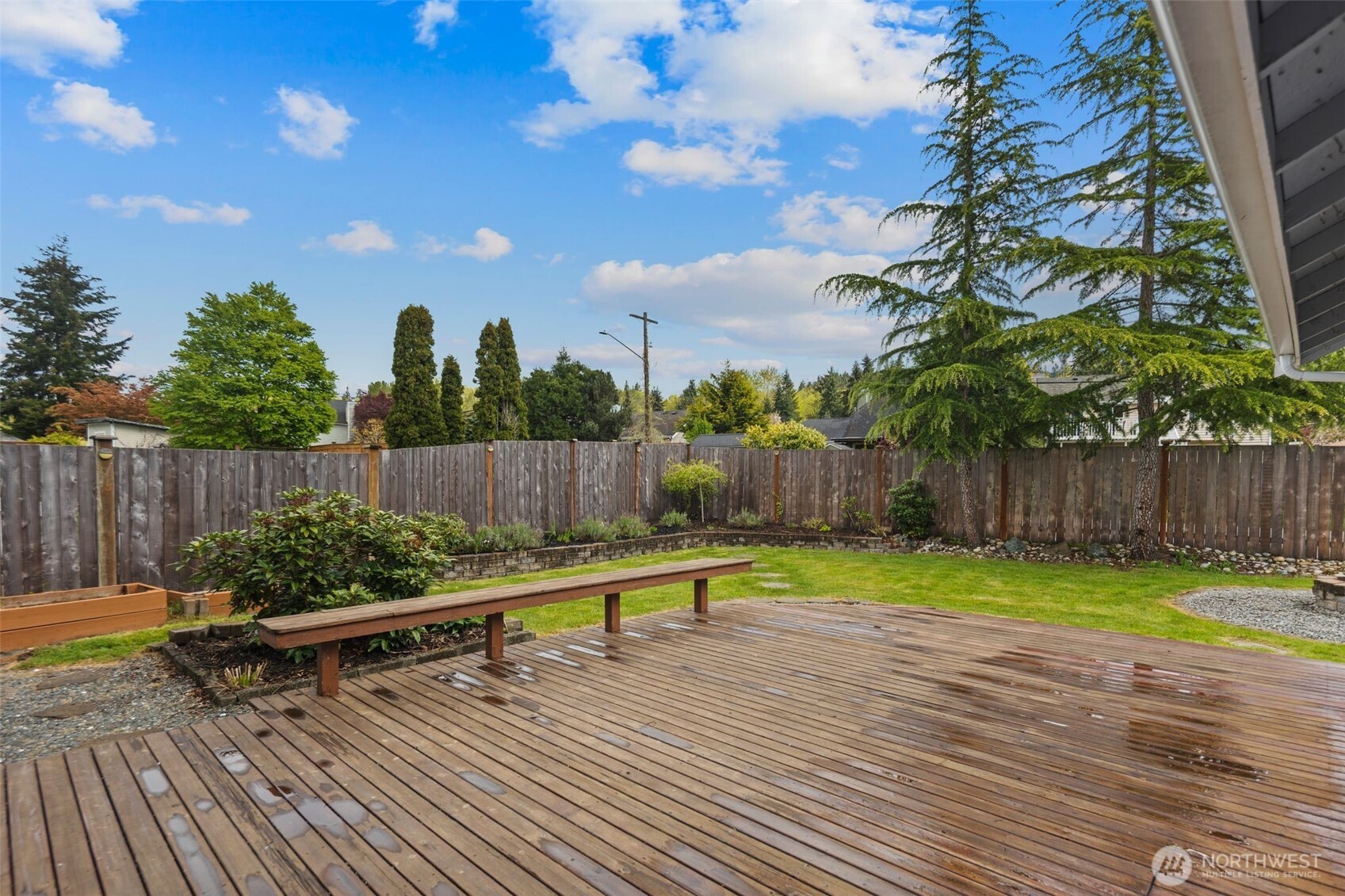 22707 14th Place West Bothell, WA 98021 - Photo 30 of 39 a view of a bench in a backyard