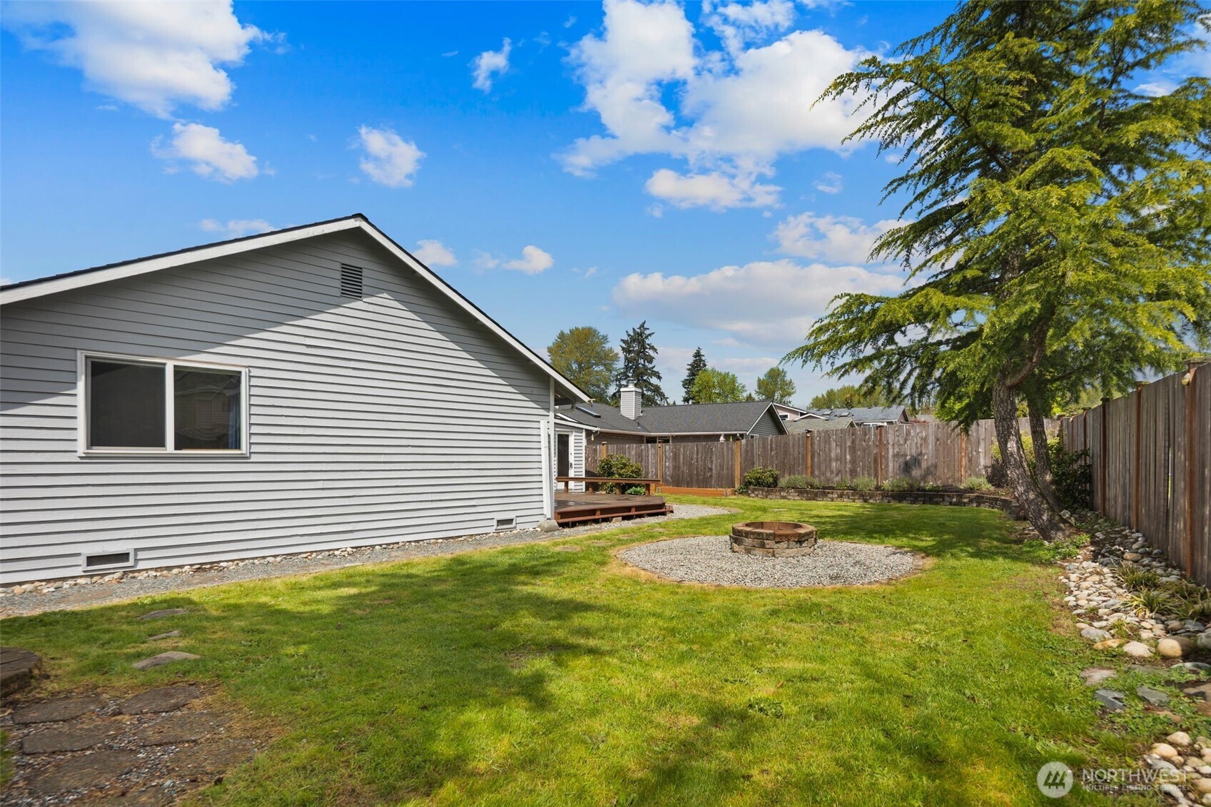 22707 14th Place West Bothell, WA 98021 - Photo 34 of 39 a backyard of a house with table and chairs