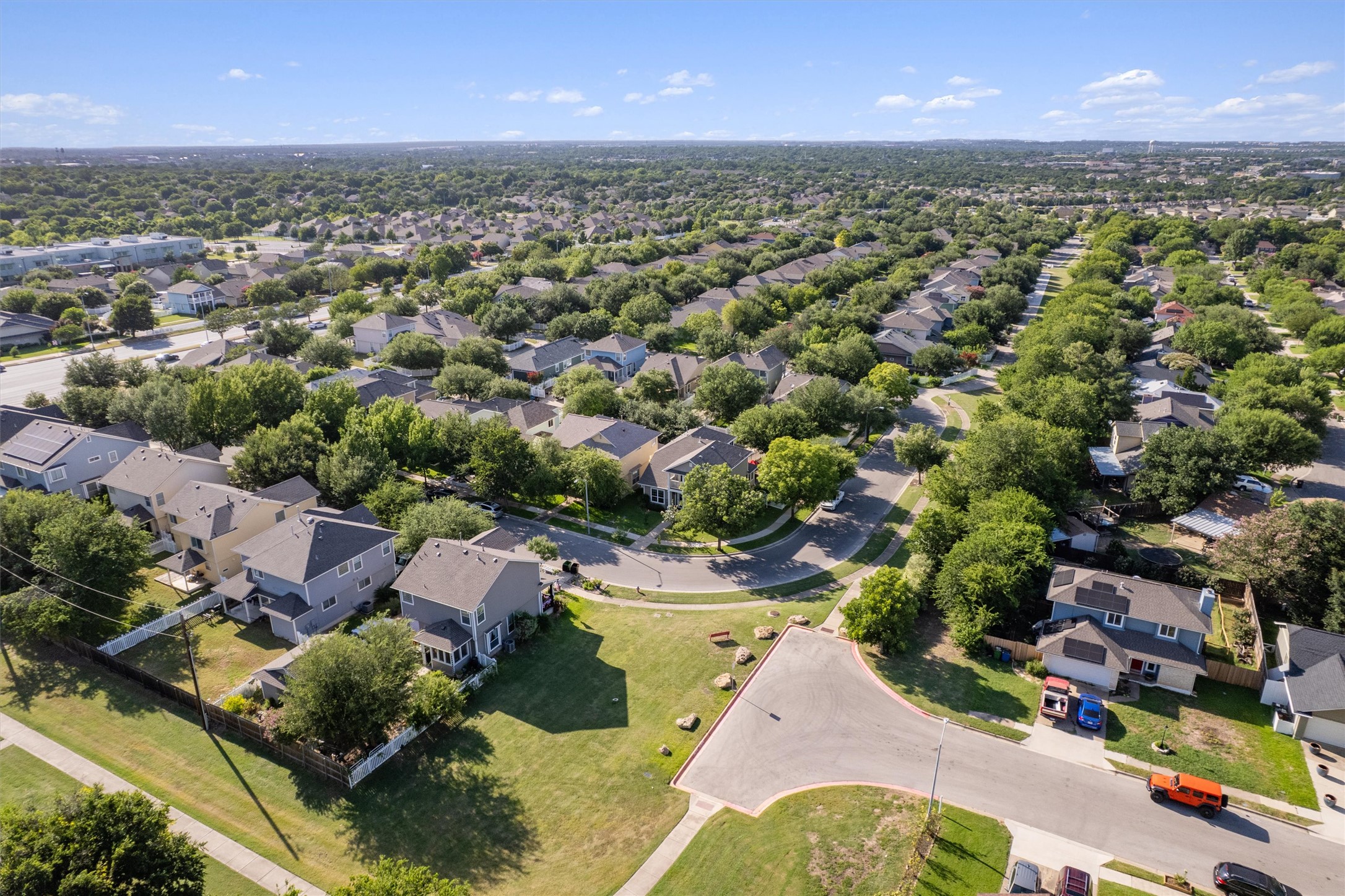 1833 Thompson Trail Round Rock, TX 78664 - Photo 38 of 40 An aerial perspective reveals a vibrant neighborhood filled with residential homes and abundant mature trees.