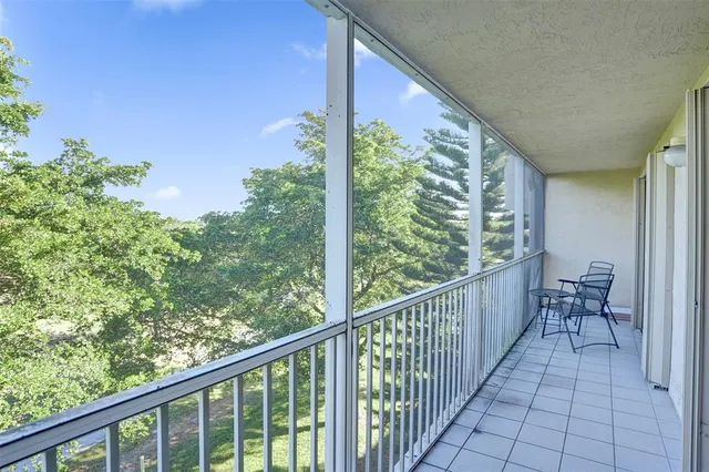 a view of a balcony with chair