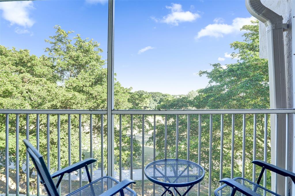 9470 Tangerine Place, Unit 404 Davie, FL 33324 - Photo 14 of 39 a view of a city from a balcony