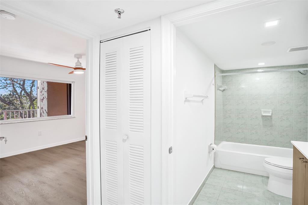 9470 Tangerine Place, Unit 404 Davie, FL 33324 - Photo 16 of 39 a bathroom with a bathtub and a shower