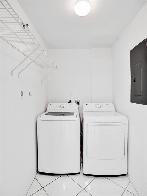 9470 Tangerine Place, Unit 404 Davie, FL 33324 - Photo 18 of 39 a utility room with dryer and washer
