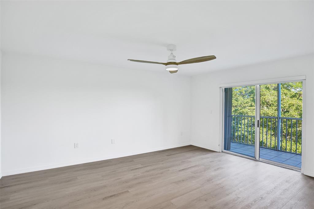 9470 Tangerine Place, Unit 404 Davie, FL 33324 - Photo 19 of 39 a view of a room with wooden floor and a window